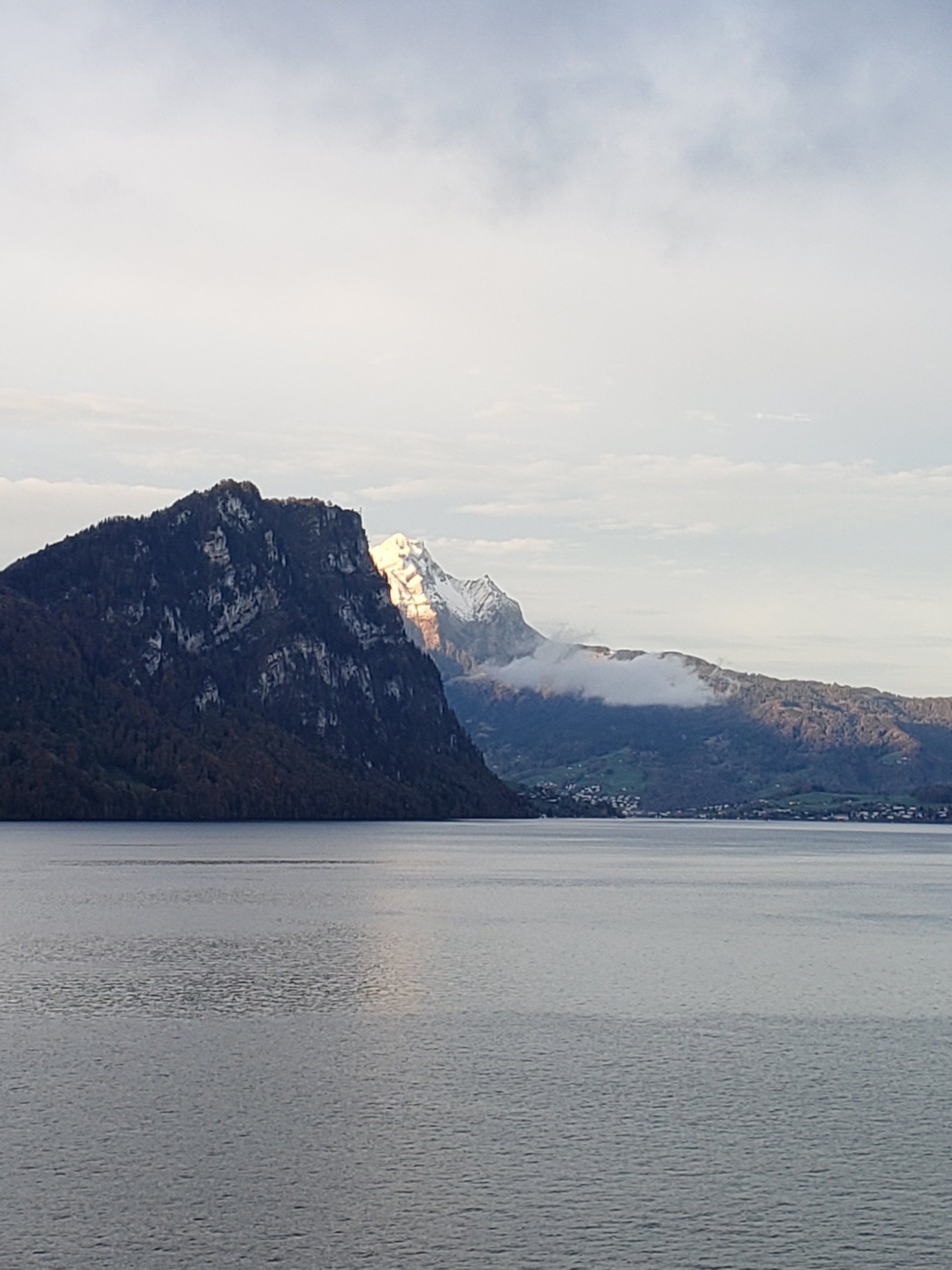 A large body of water with mountains in the background