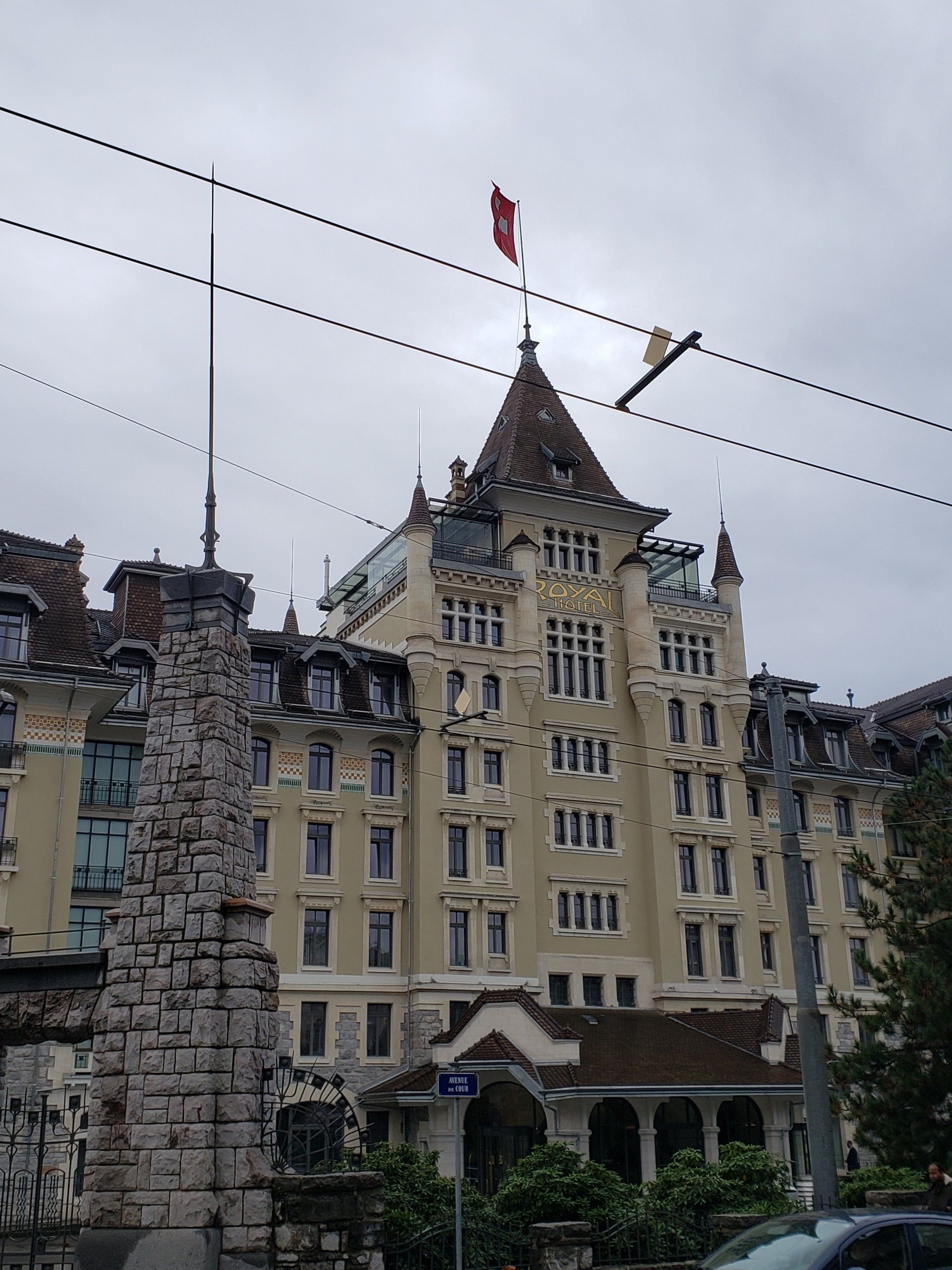 A large building with a red flag on top of it