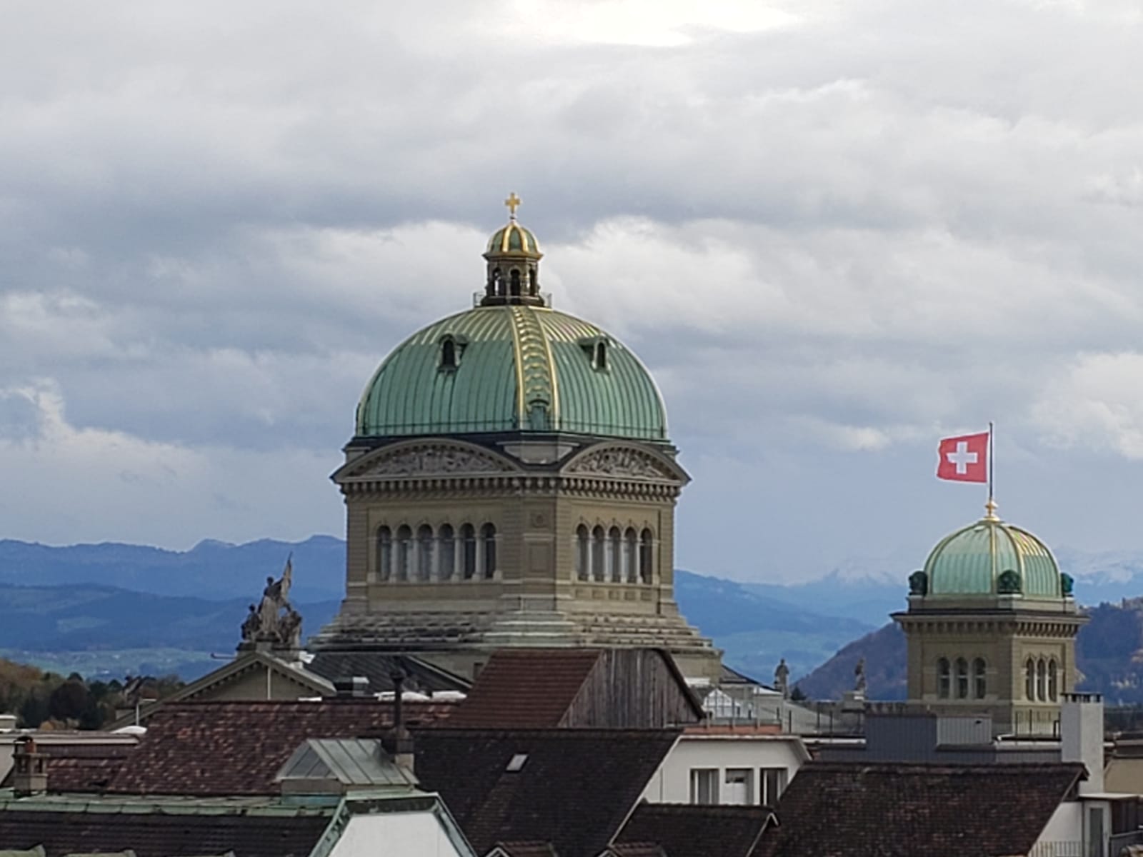 A dome with a swiss flag on top of it