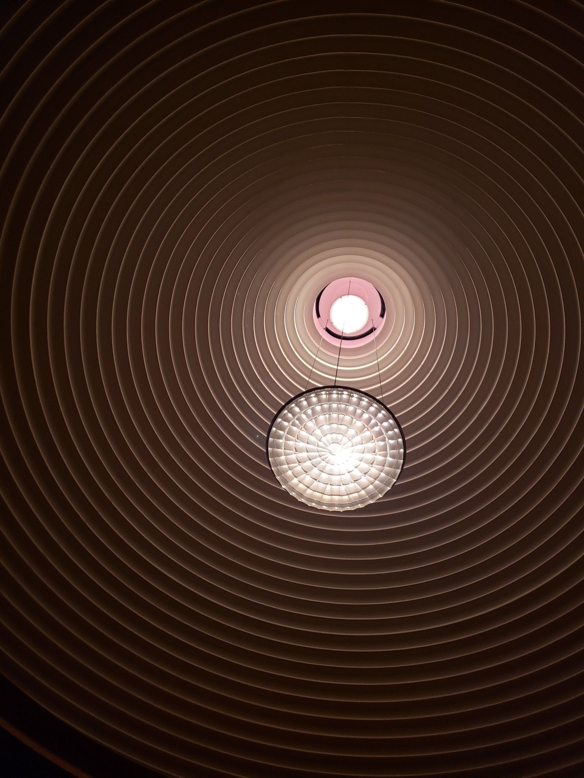 Looking up at a ceiling with a light in the middle