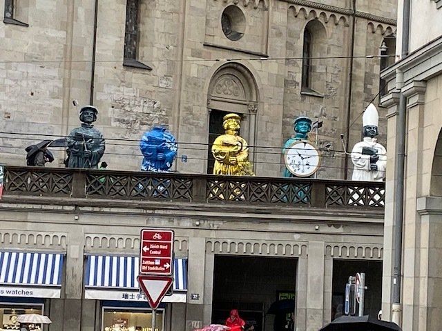 A building with statues and clocks on top of it