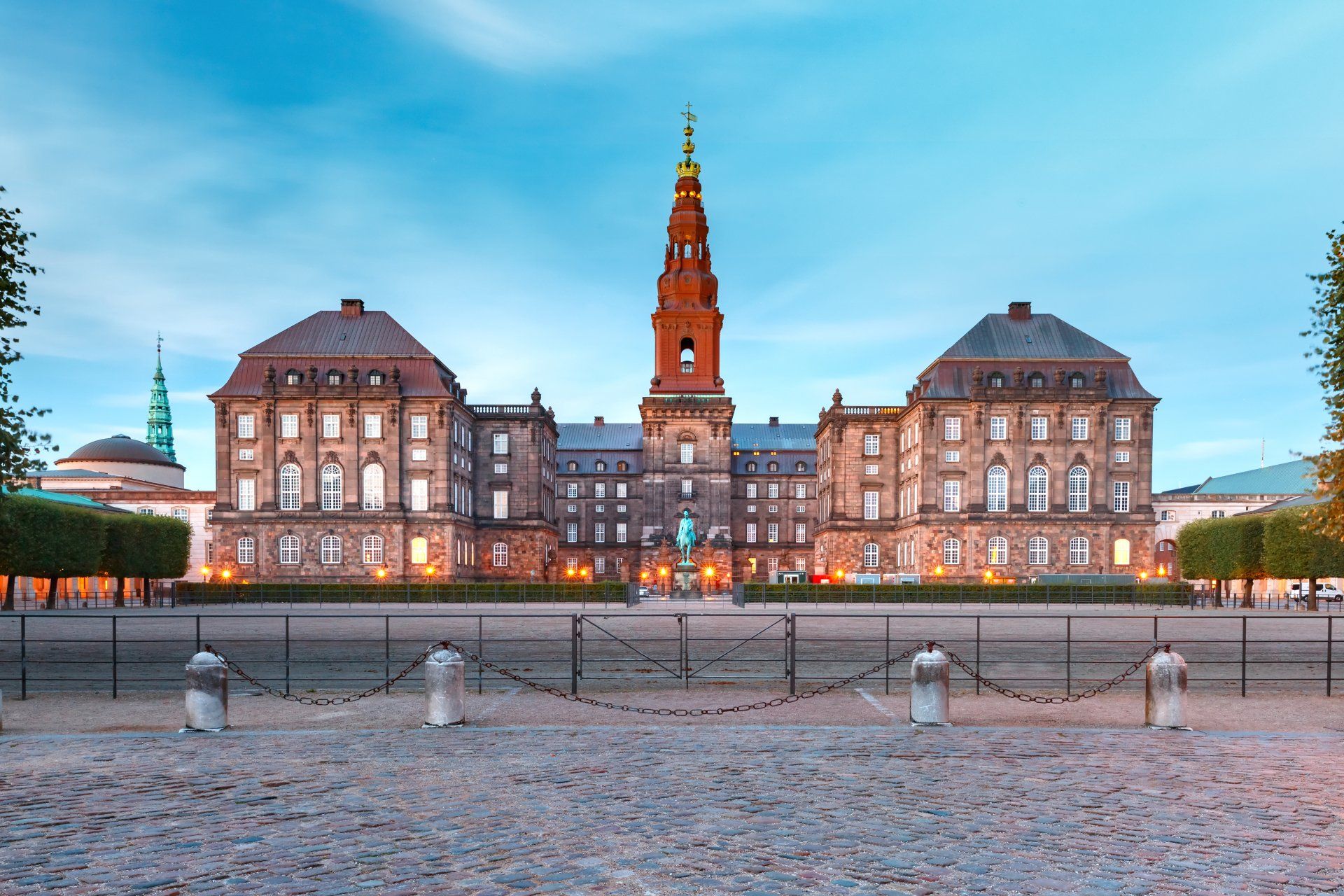 A large building with a clock tower in the middle of it