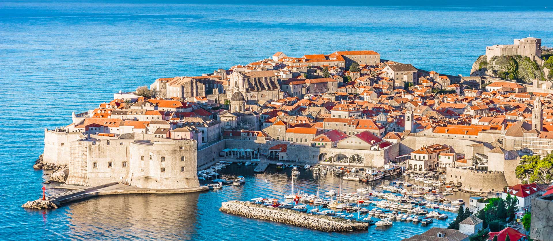 An aerial view of a small town in the middle of the ocean.