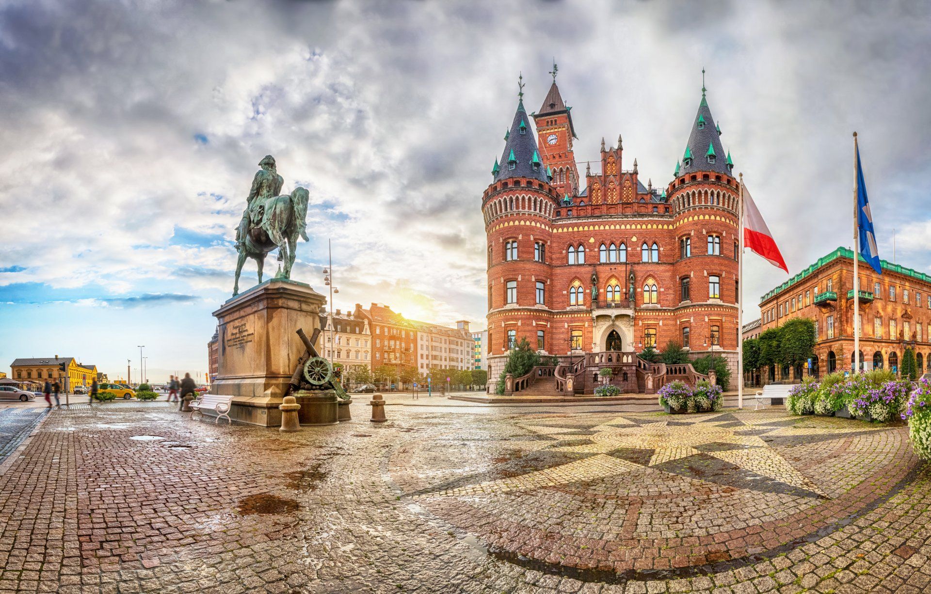 There is a statue of a man on a horse in front of a large building.
