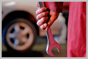 Mechanic holding a spanner