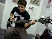 Boy in a black shirt with a bass