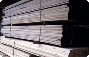 timber beams stacked up on pallets