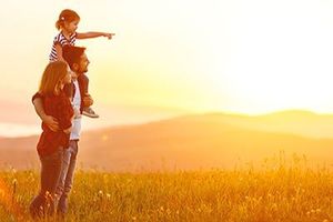 happy family watching the sunset