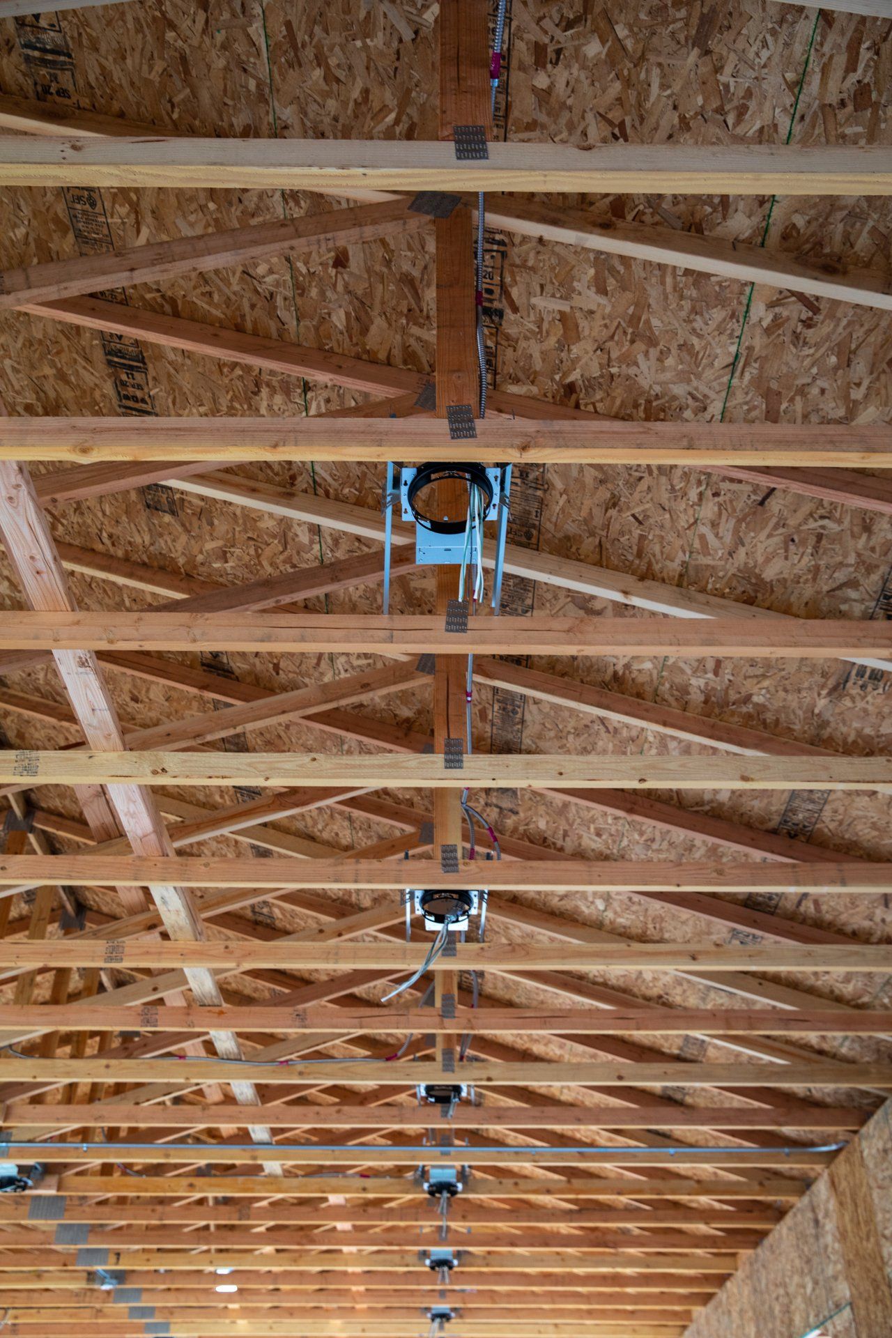 A close up of the ceiling of a house under construction.