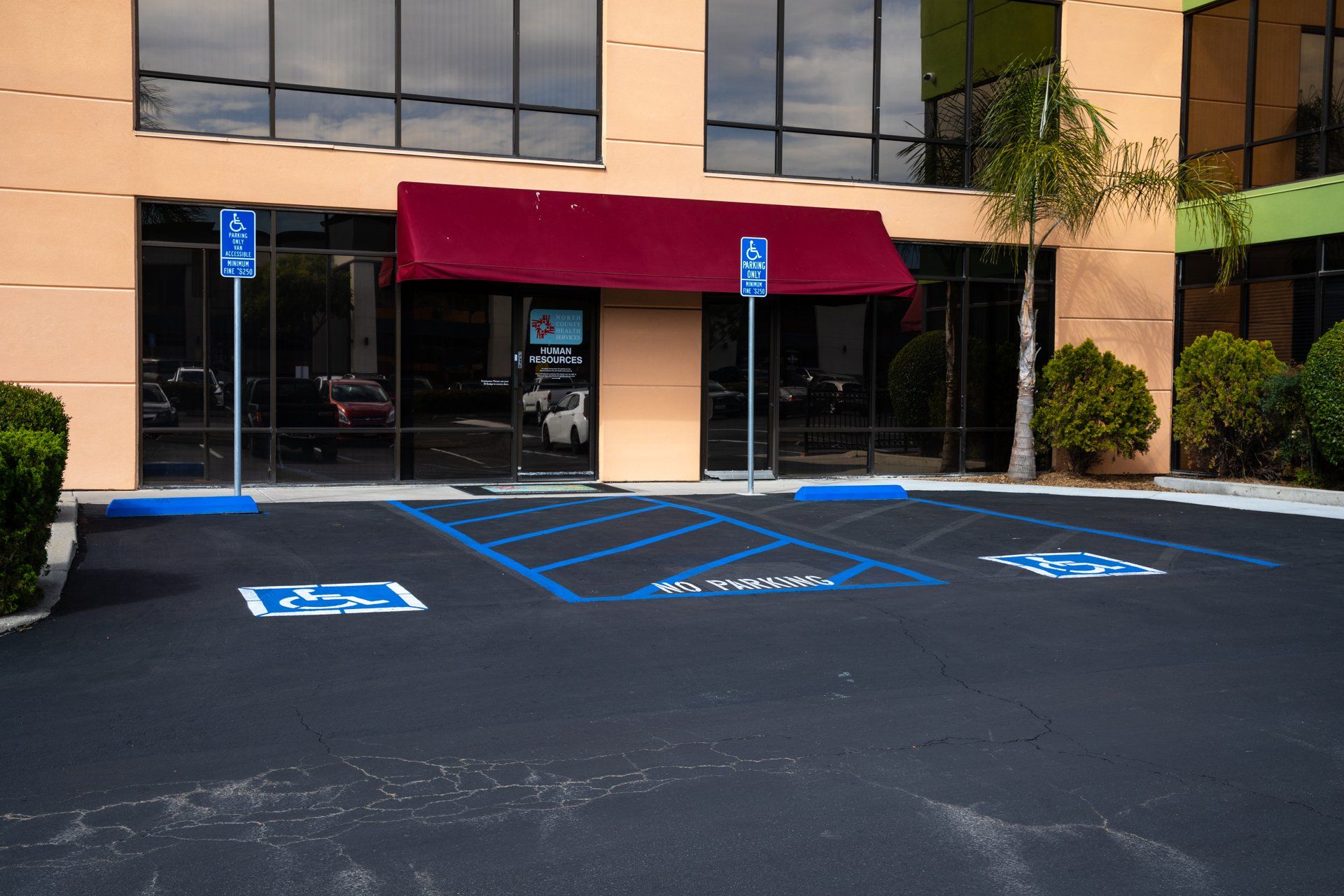 A handicapped parking spot is in front of a building