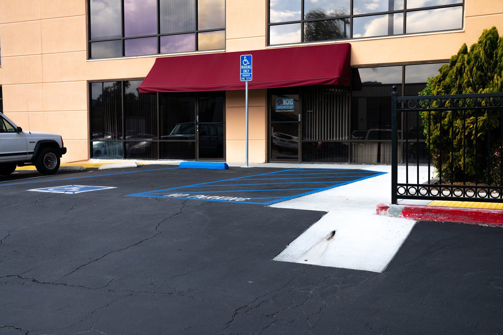 A handicapped parking spot in front of a building