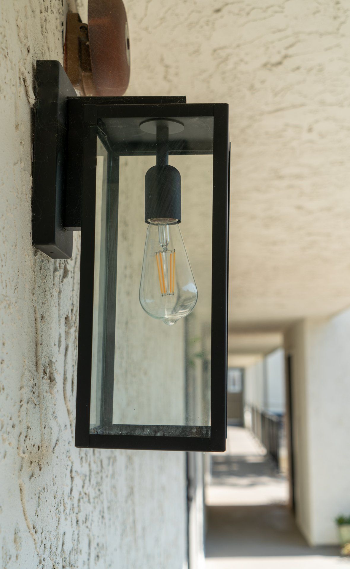 A lantern with a light bulb inside of it