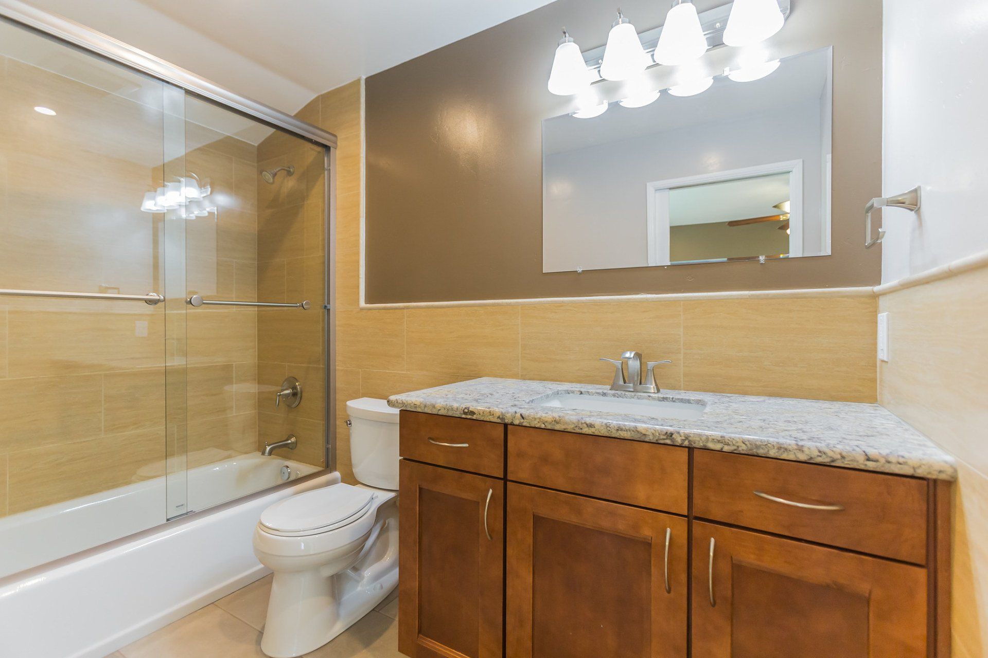 A bathroom with a toilet a sink and a bathtub