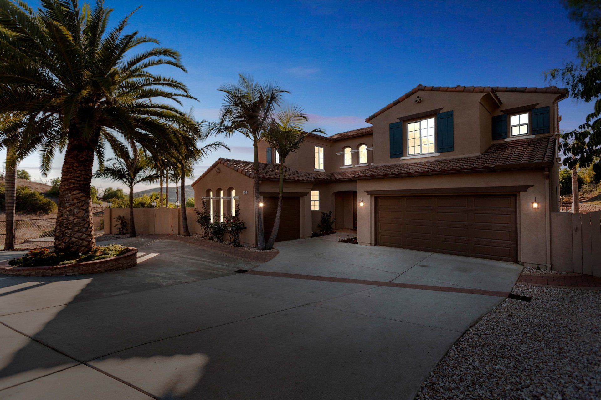 A large house with palm trees in front of it