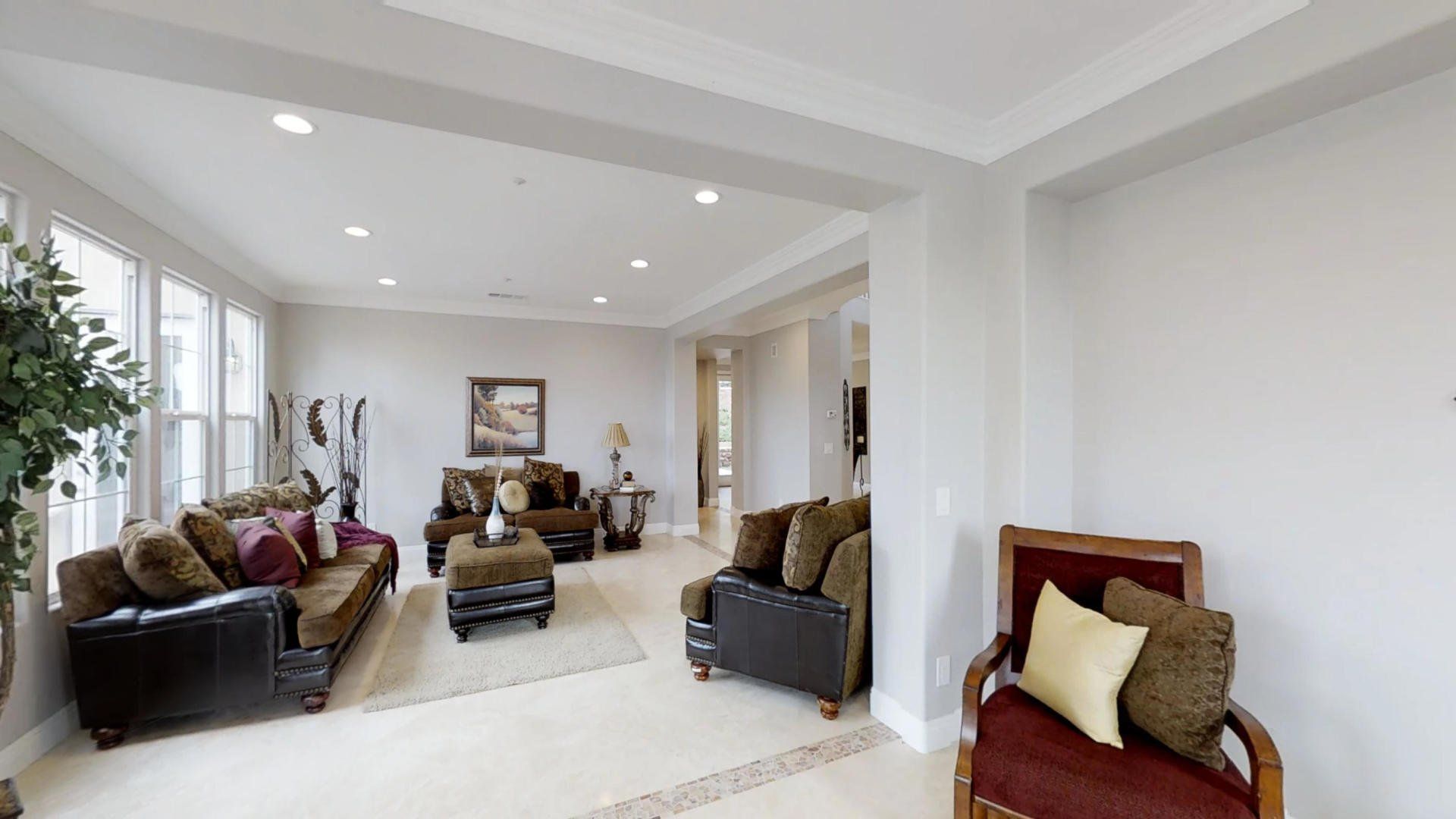 A living room with a couch , chair , and table.