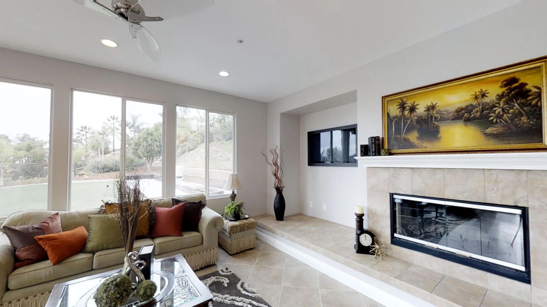A living room with a fireplace and a couch.