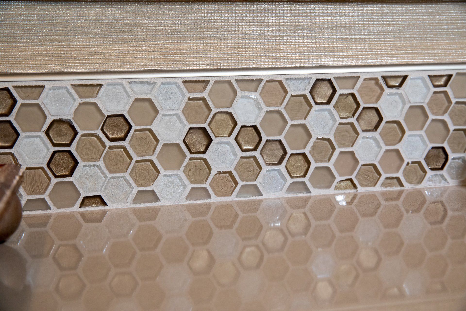 A close up of a tile that looks like honeycombs