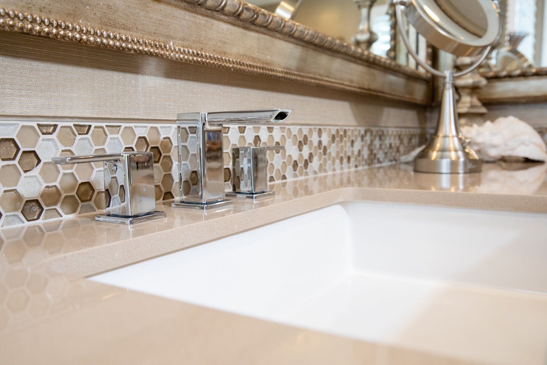 A bathroom sink with a mirror behind it
