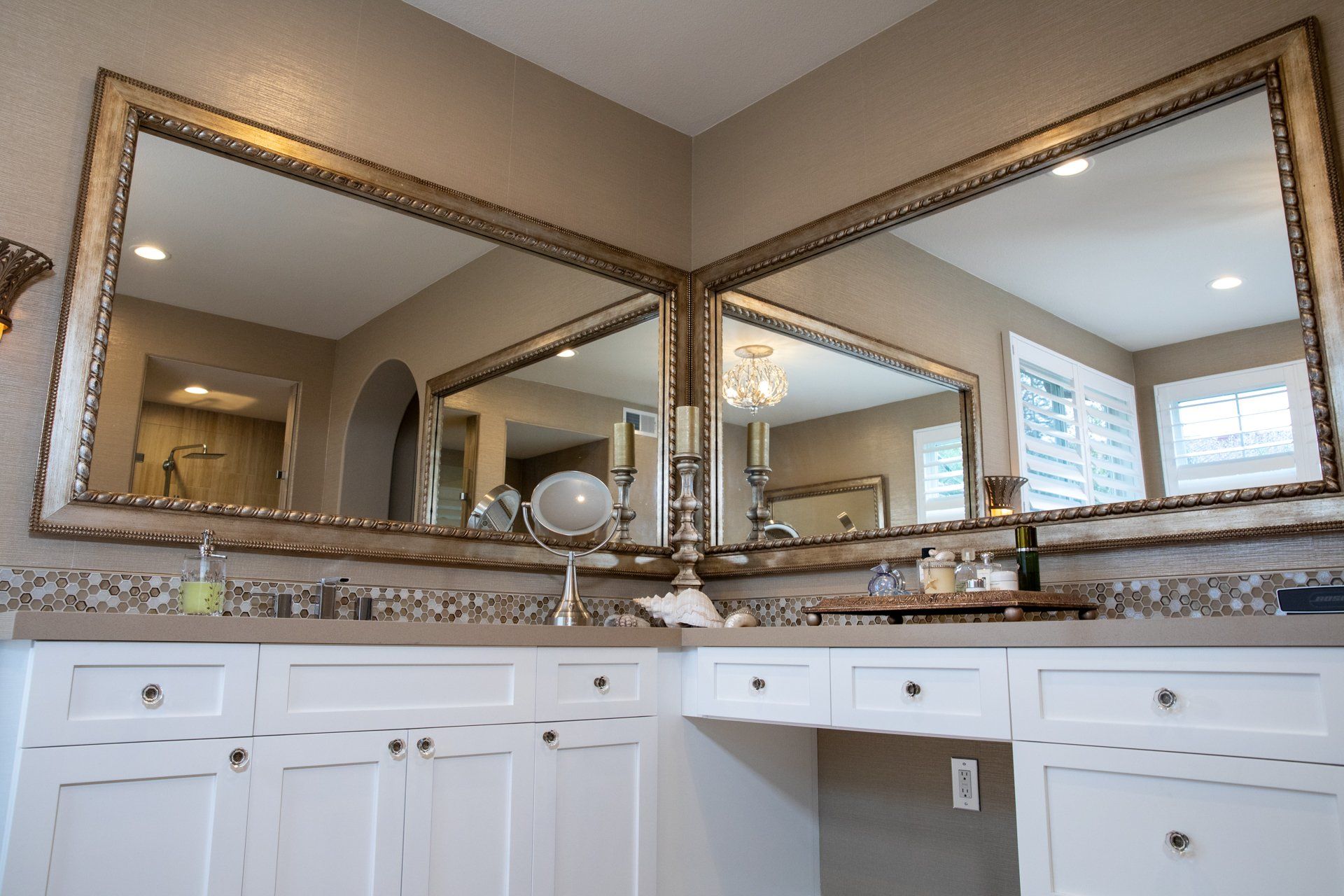 A bathroom with two sinks and two mirrors