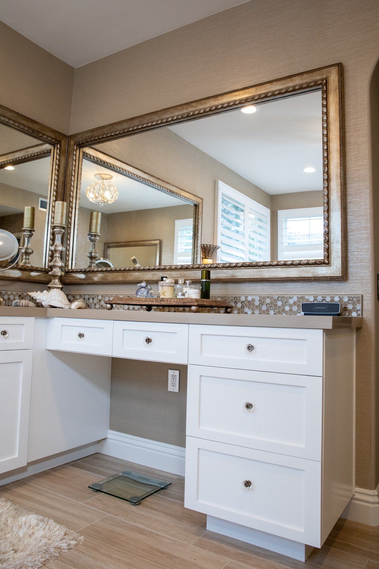 A bathroom with two sinks and a large mirror