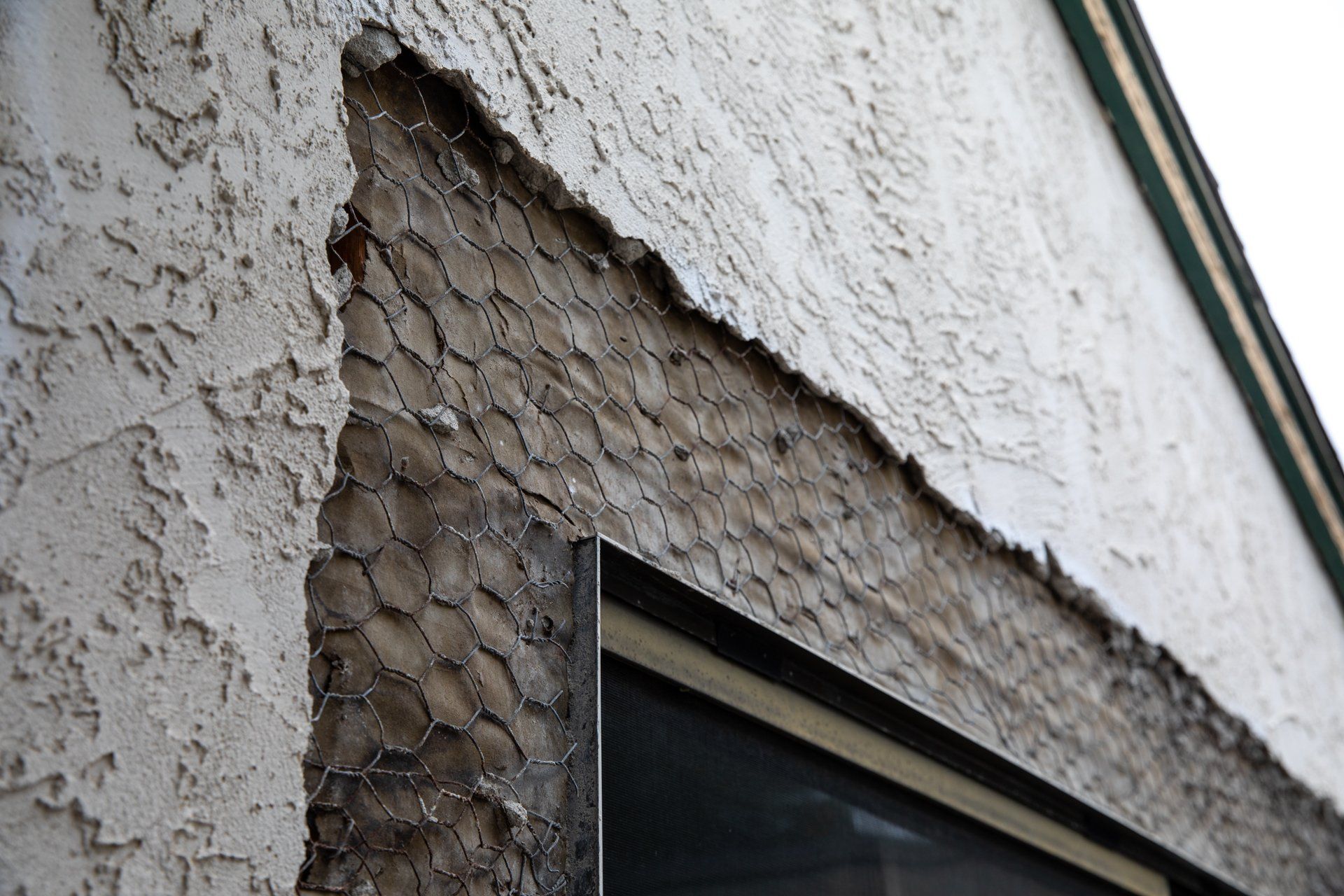 A close up of a brick wall with a window