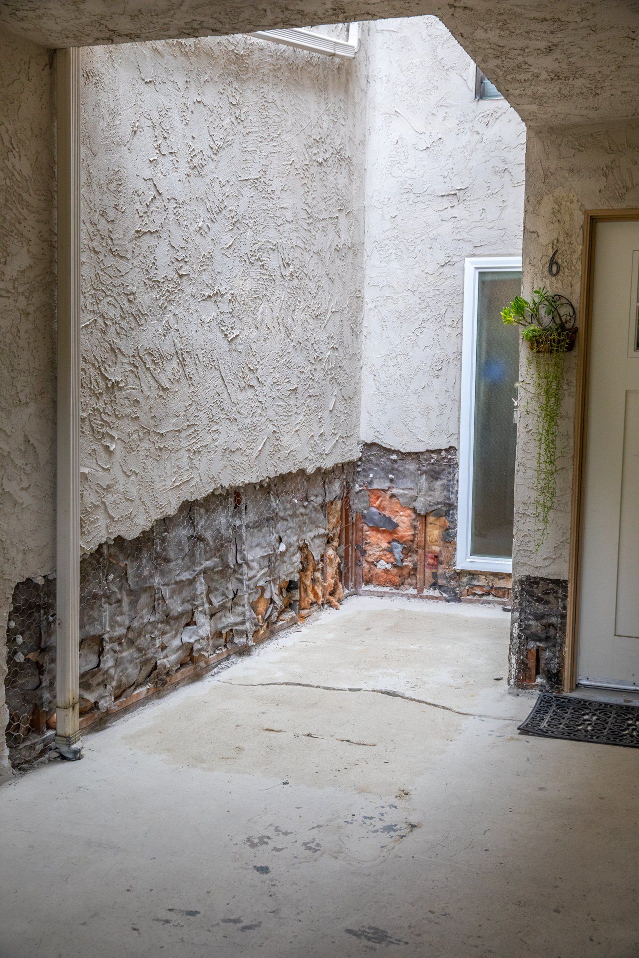 A white door with the number 6 on it