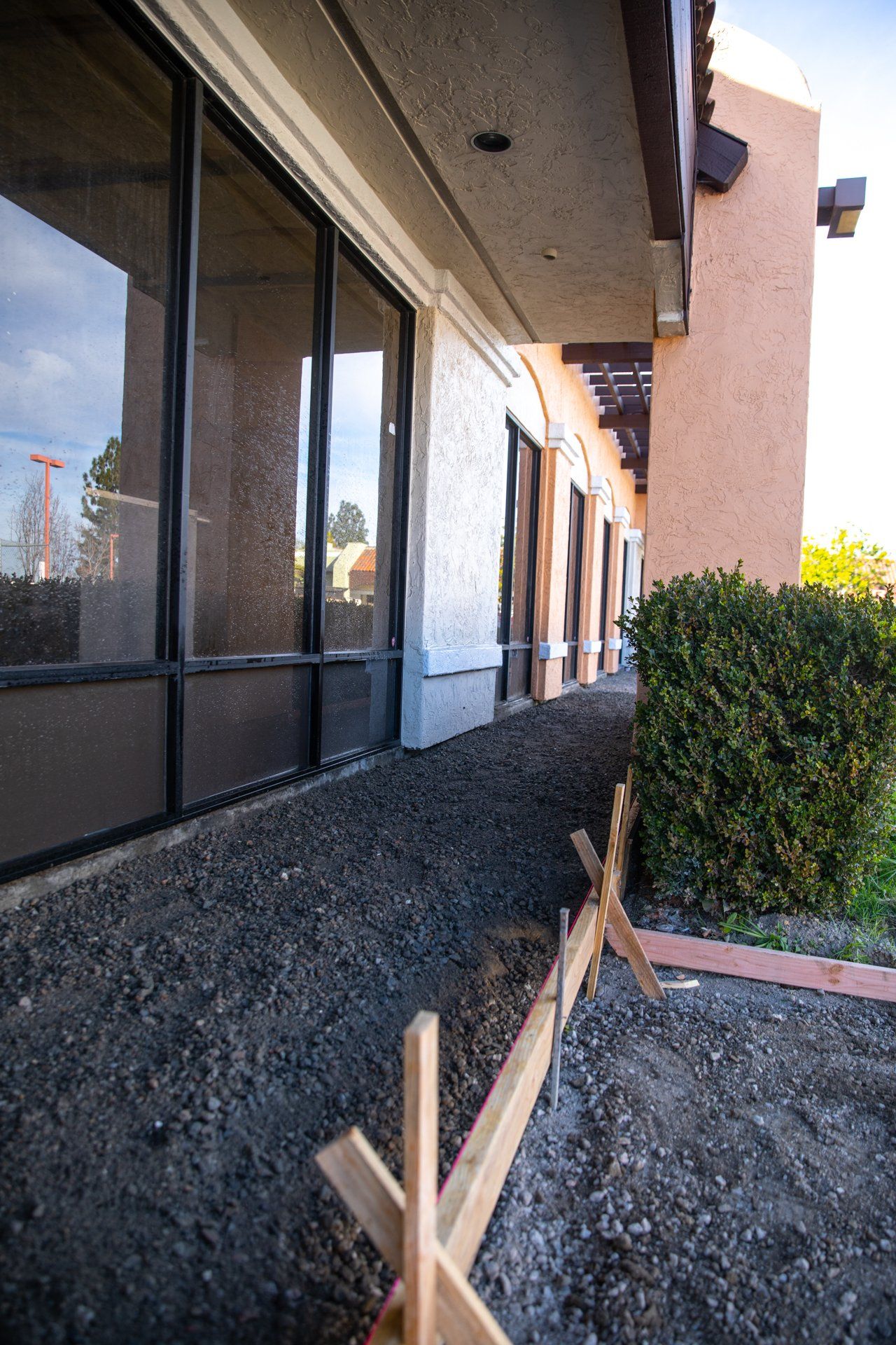 A sidewalk is being built in front of a building