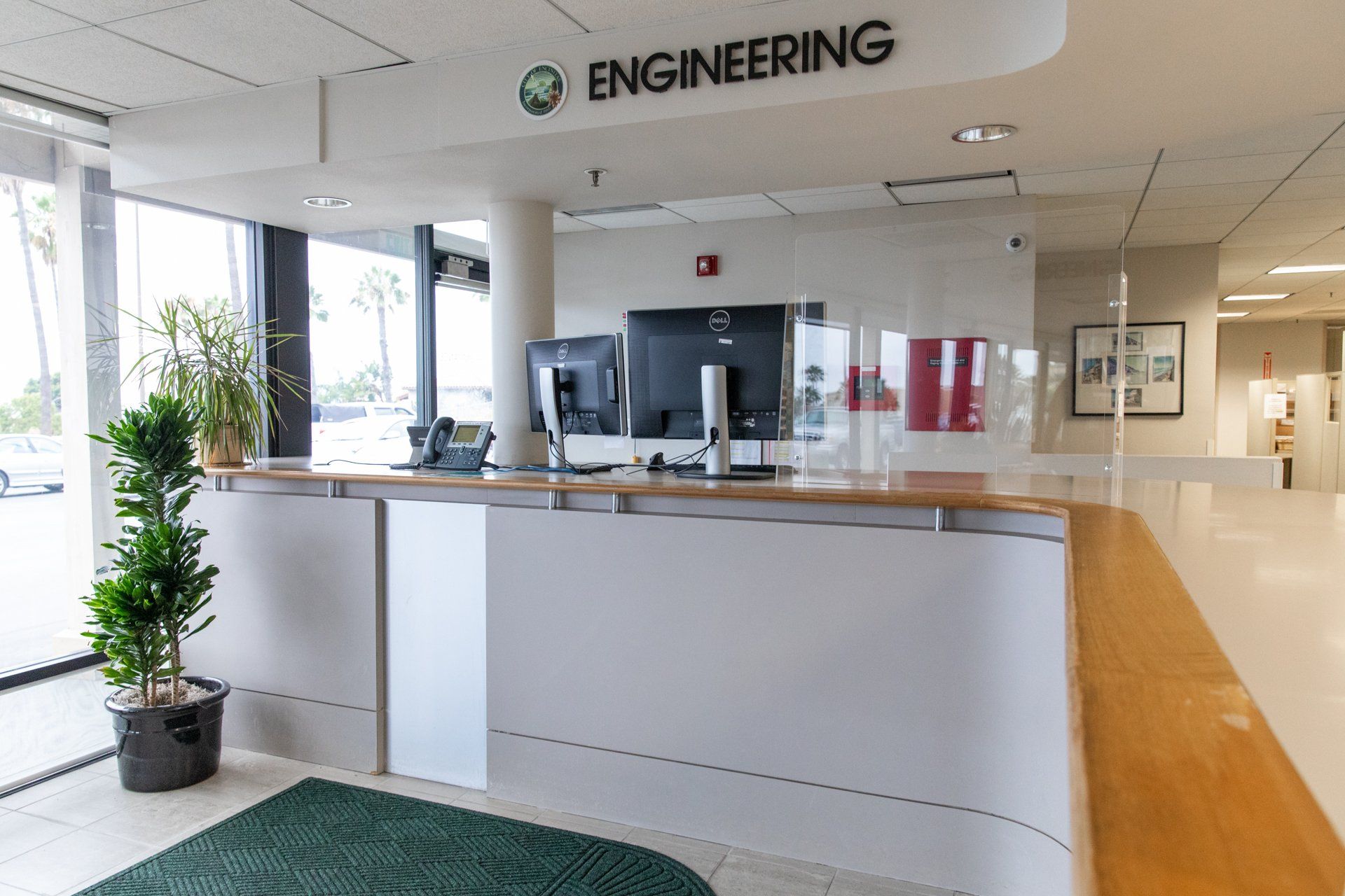 A reception desk with a sign above it that says engineering