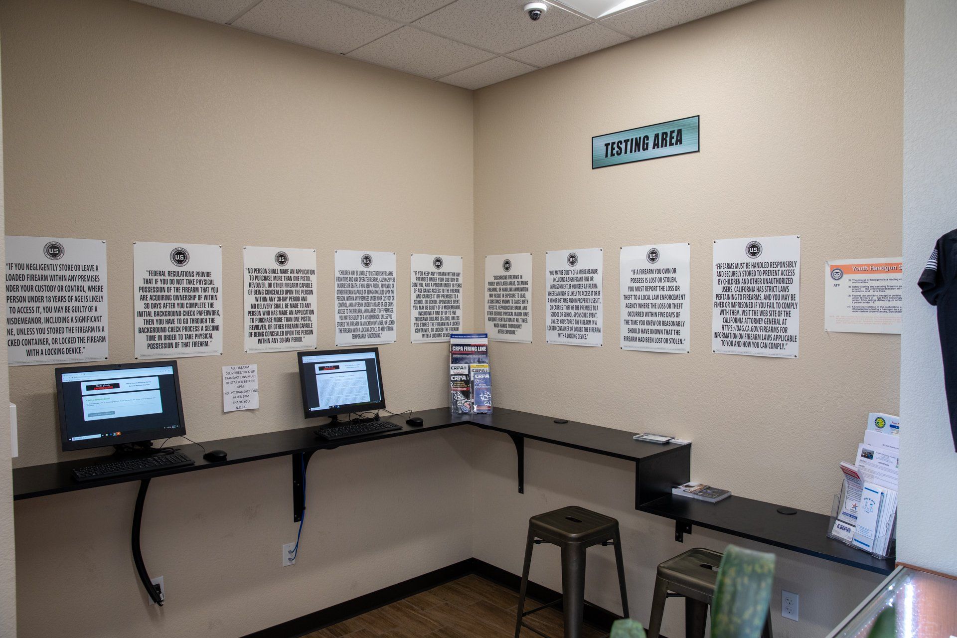 A room with a lot of papers on the wall and computers