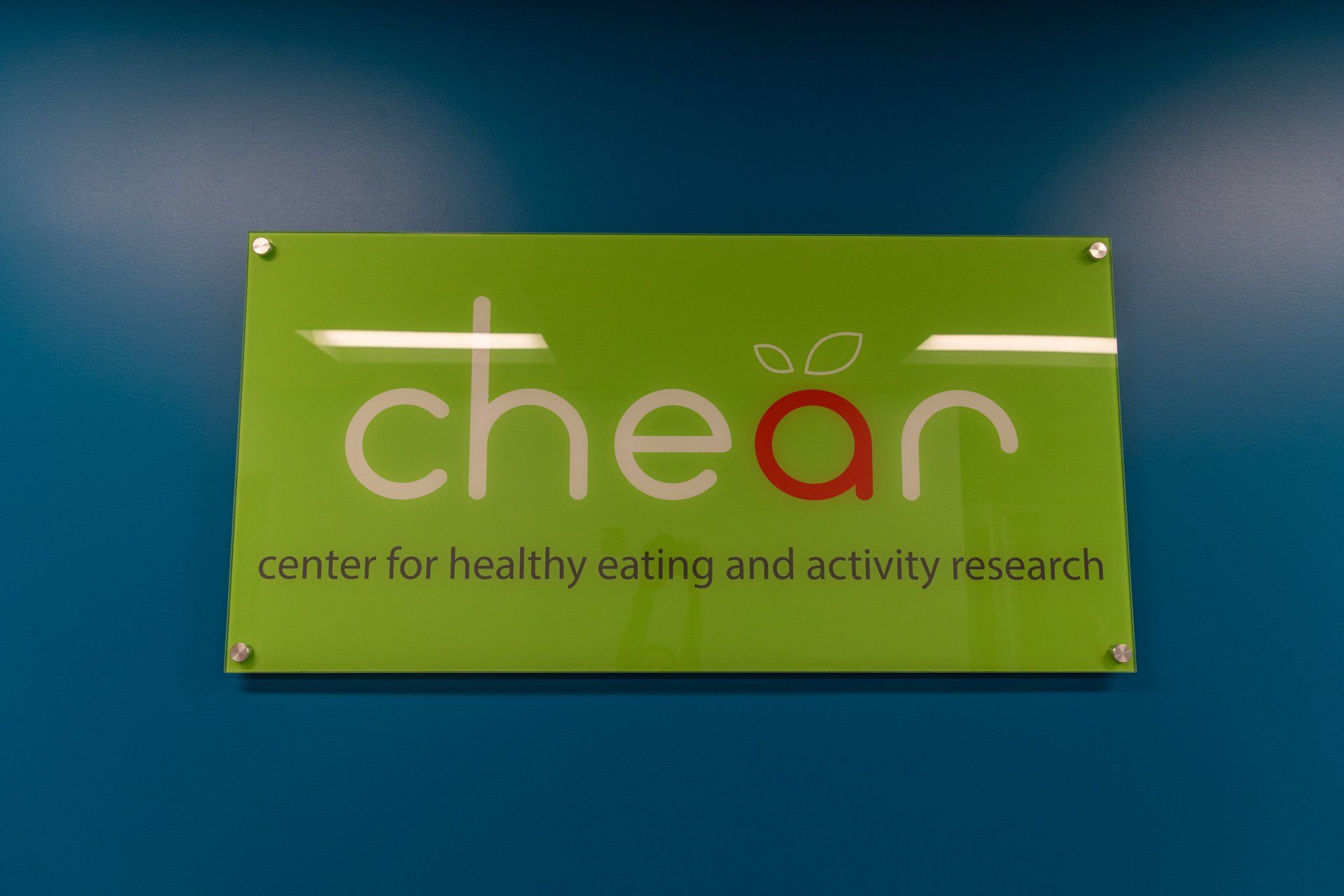 A green sign that says chear center for healthy eating and activity research