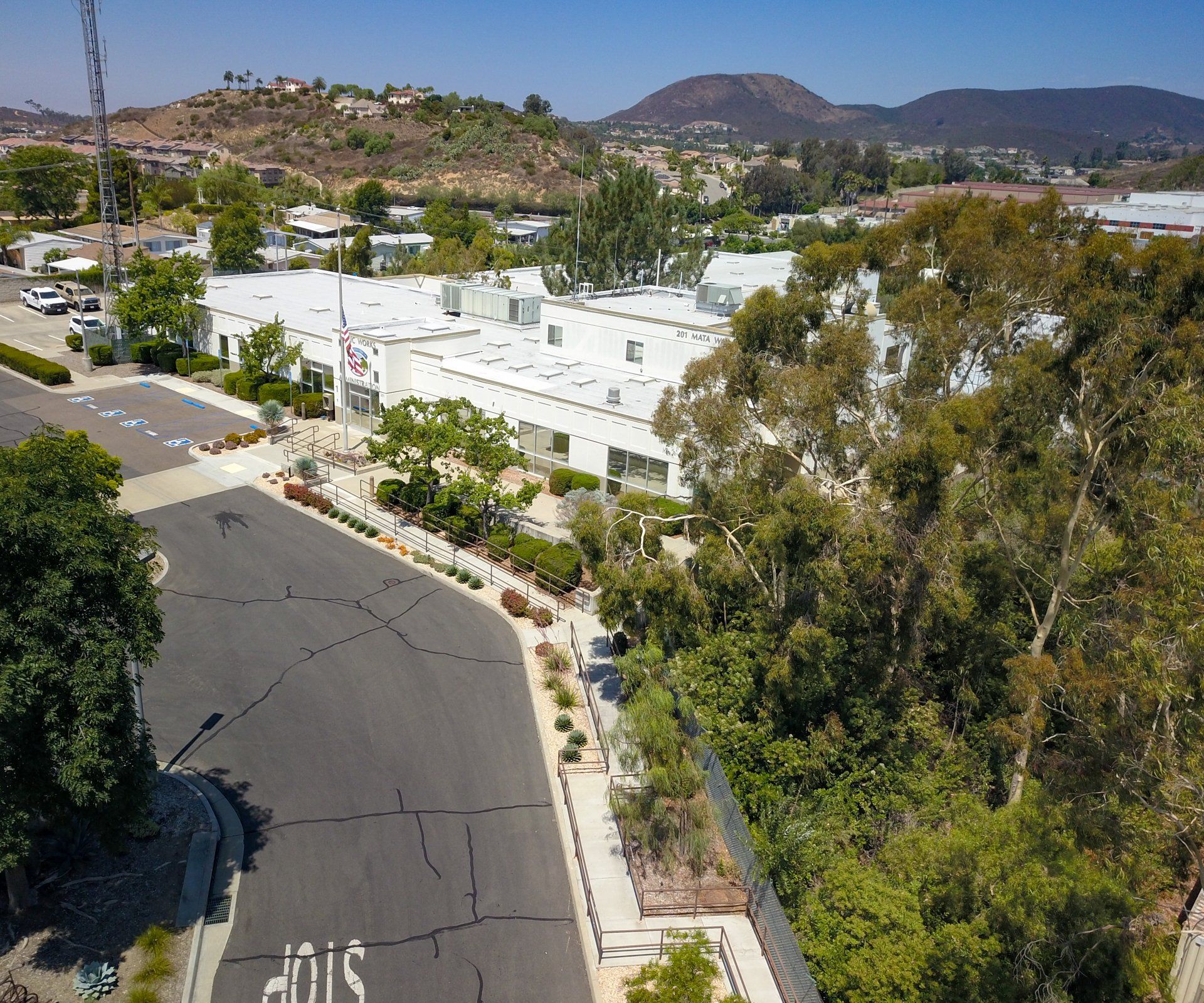 An aerial view of a street with a stop sign on it