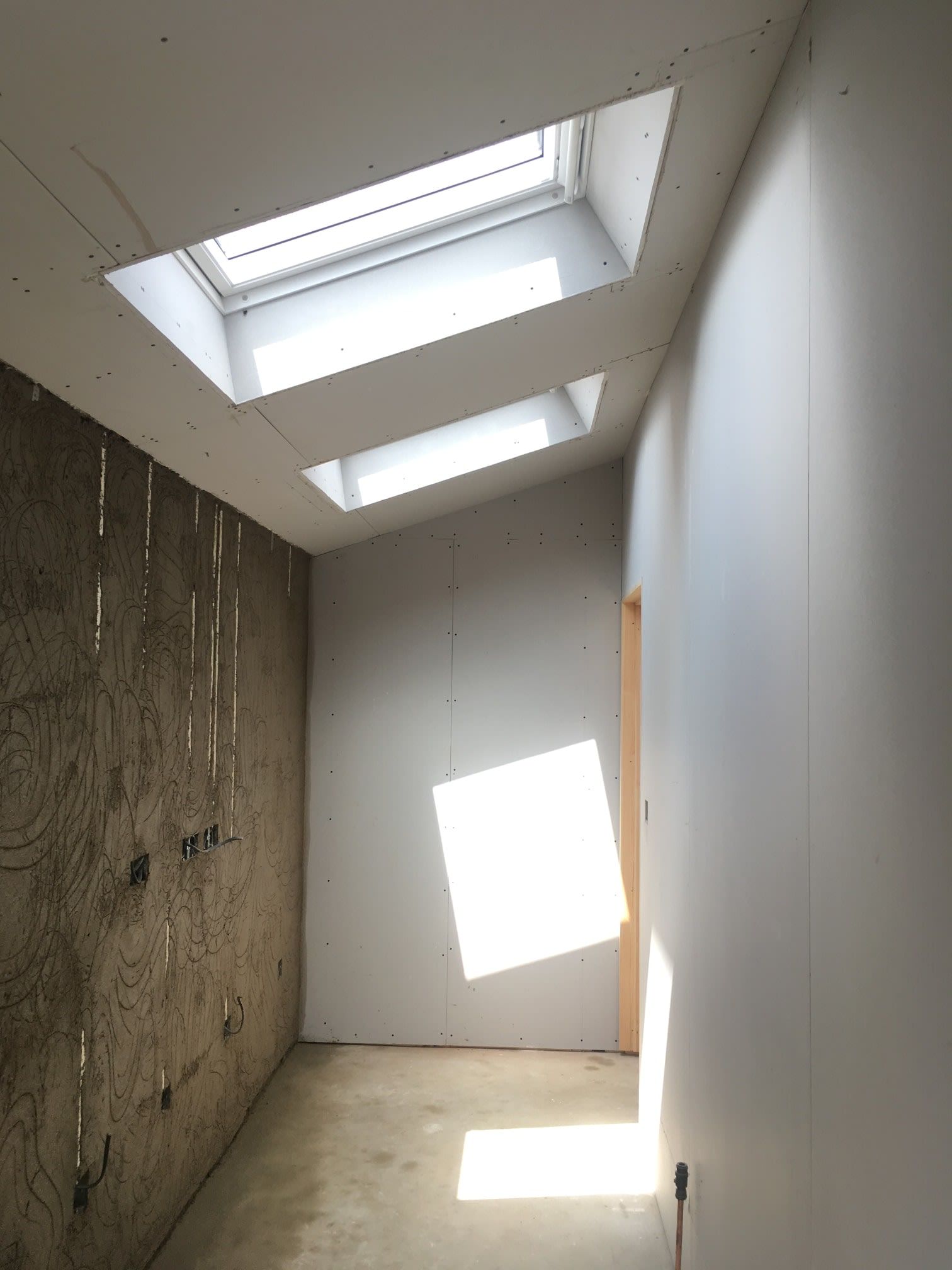 Sloping ceiling with new plaster