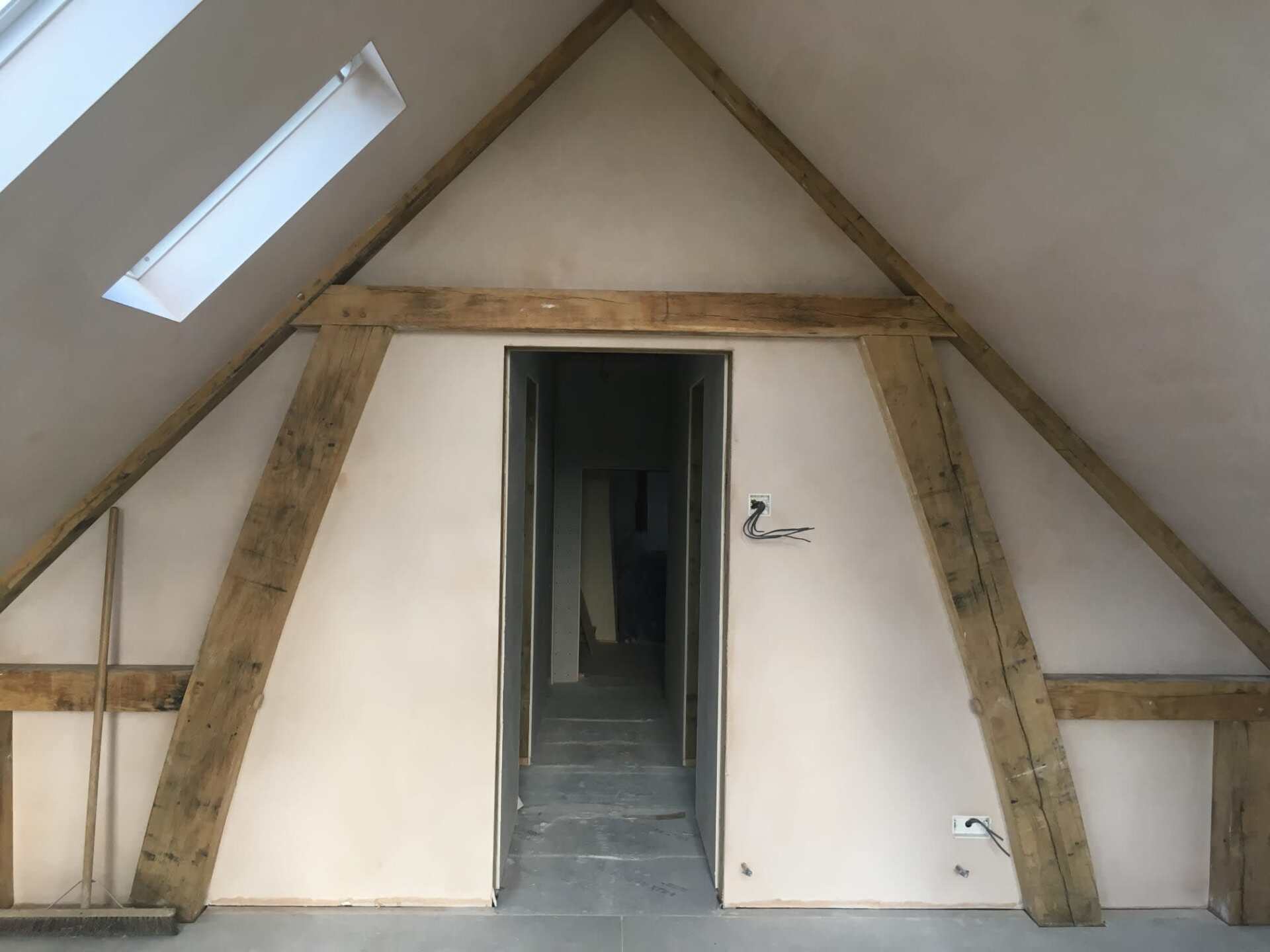 New plaster under a pitched roof
