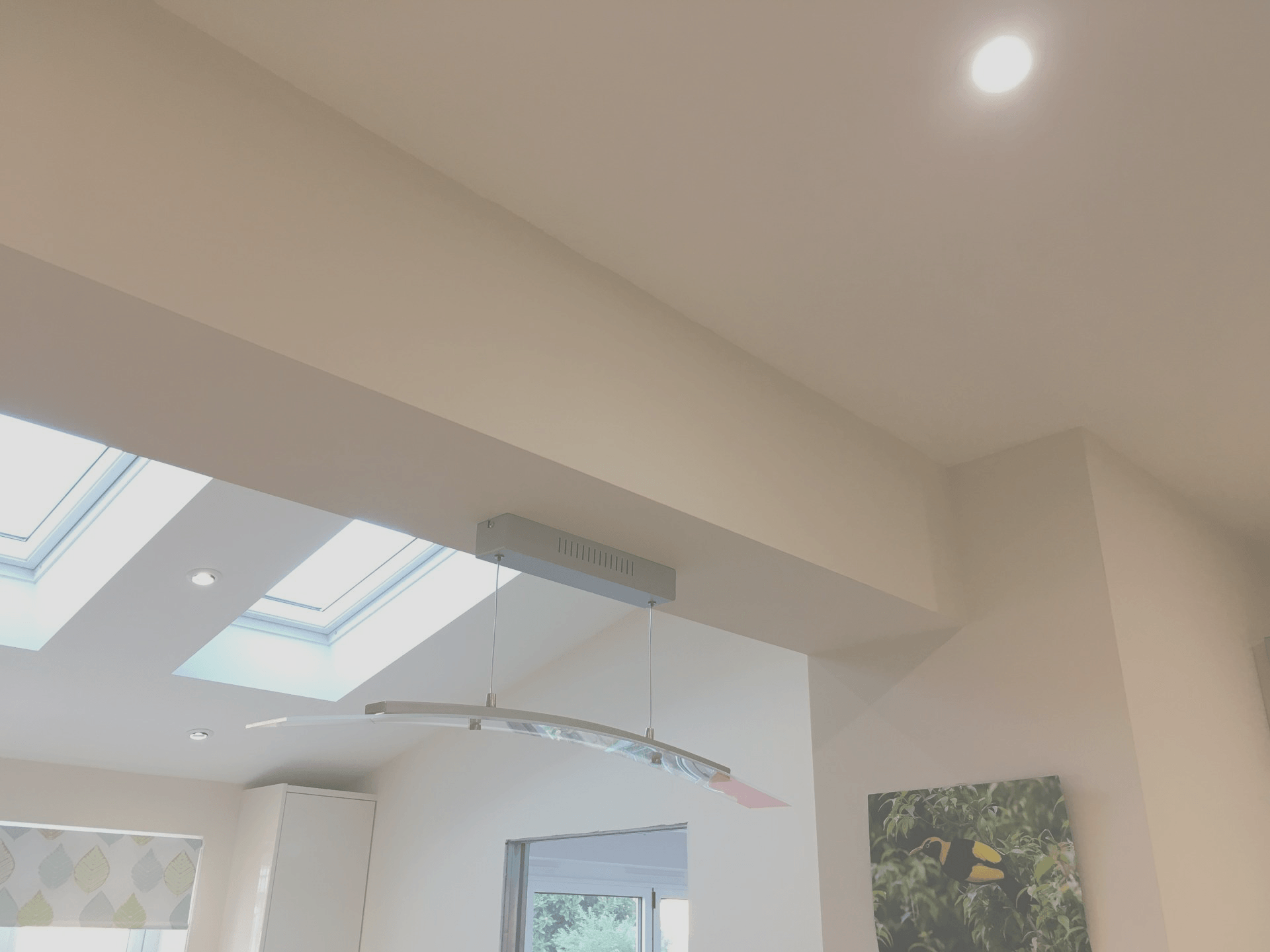 White ceiling beam with fresh plaster