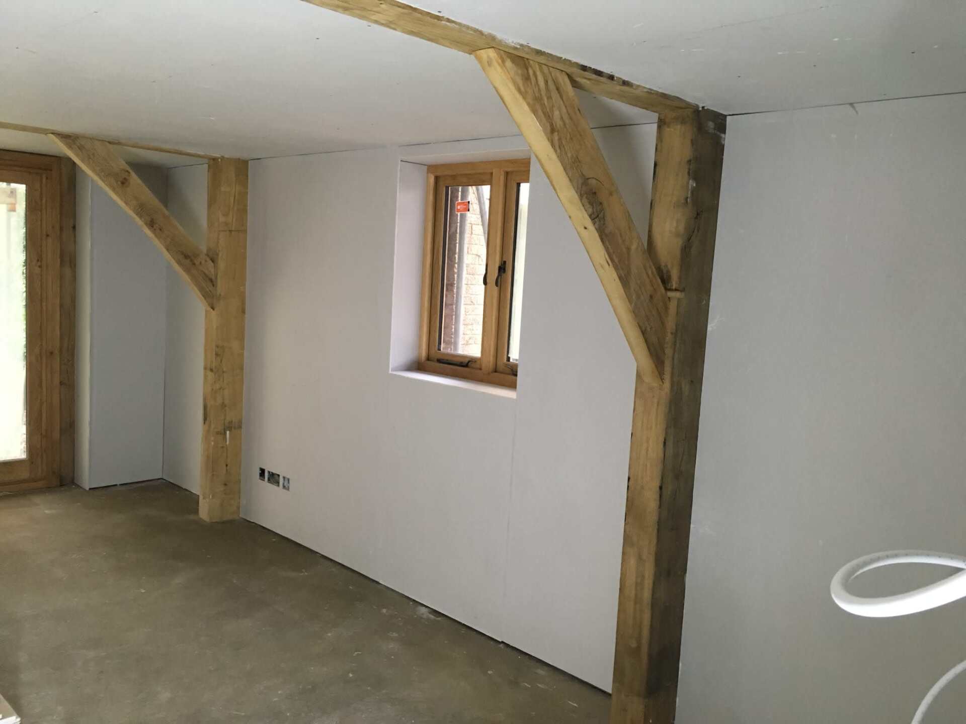 Structural beams by a wall