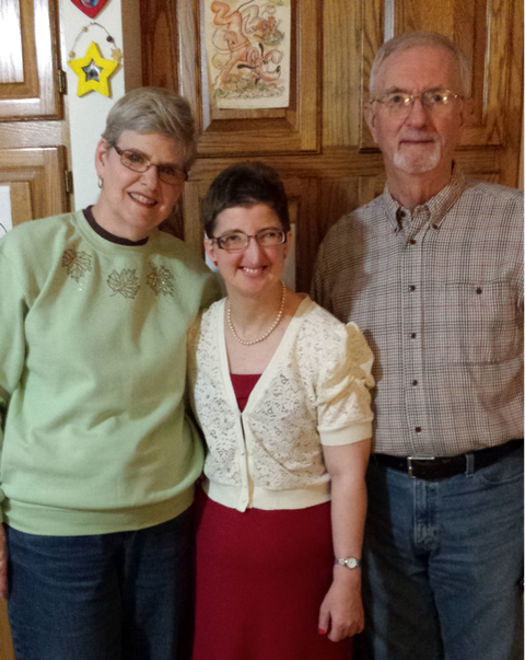 Angie, with her parents, Carol and Carl Pickett