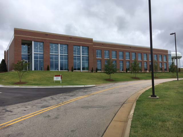 Building Across The Road With Trees Beside It — Goldsboro, NC — Ernest Glass Co. Inc.