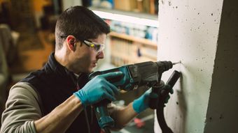 drilling into concrete wall