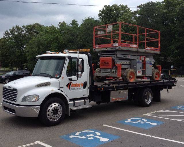 Transporting A Scissor Lift — Insley’s Towing and Recovery — Pine Bluff, AR Transporting A Scissor Lift — Insley’s Towing and Recovery — Pine Bluff, AR