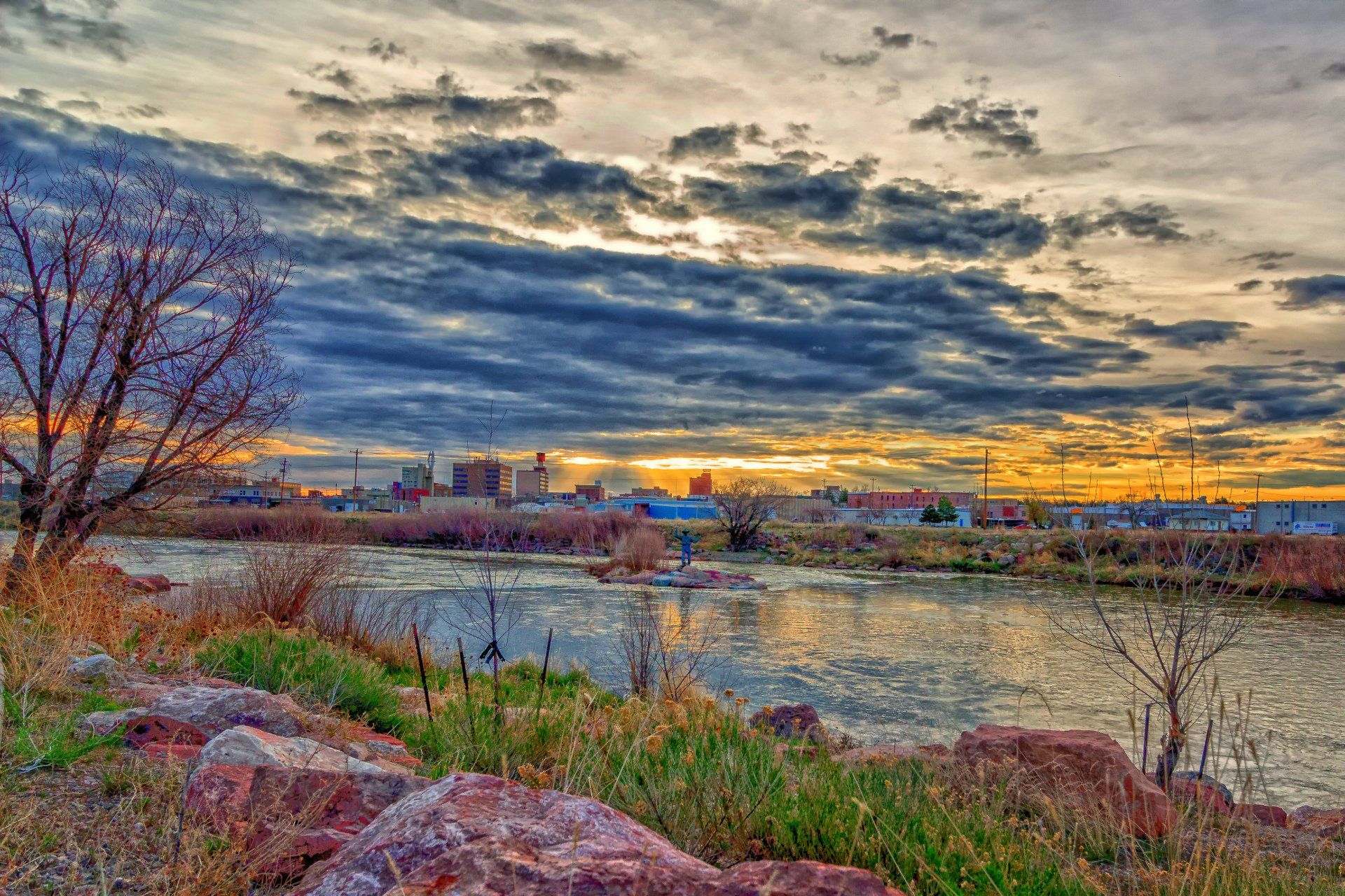 Scenic shot of river with city in background