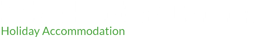 A white background with green text that says holiday accommodation