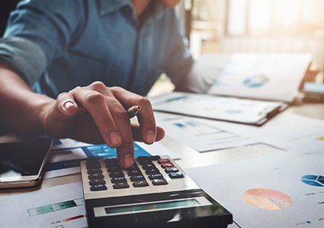 Tax Preparation — Employee Using Calculator in Semmes, AL