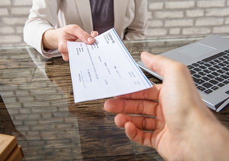 Payroll Services — Employee Giving Cheque in Semmes, AL
