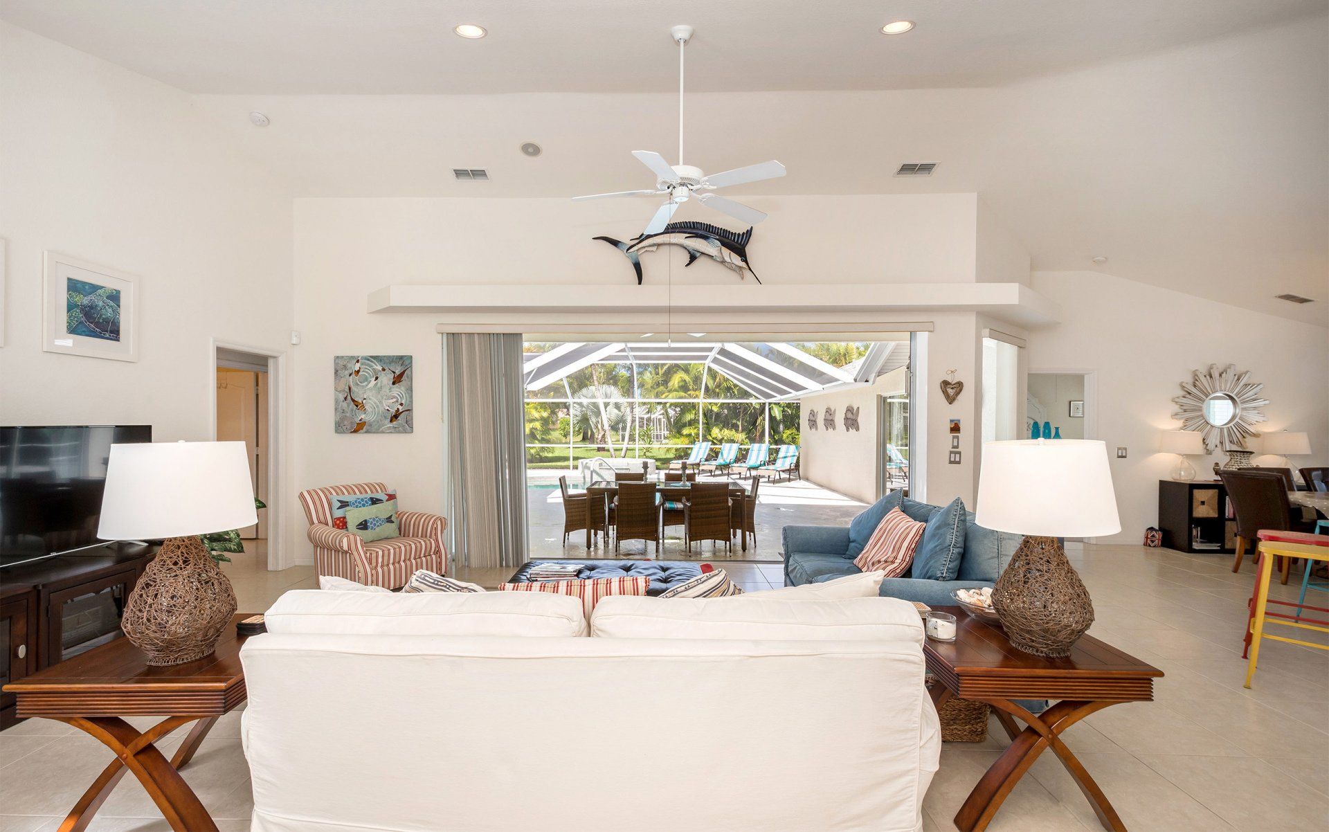 Living room looking through to pool area at Naples Lake View, Florida