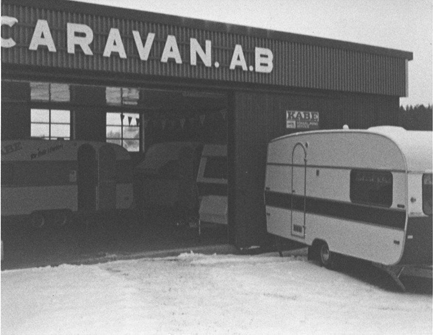 Black and white photo of a building labeled