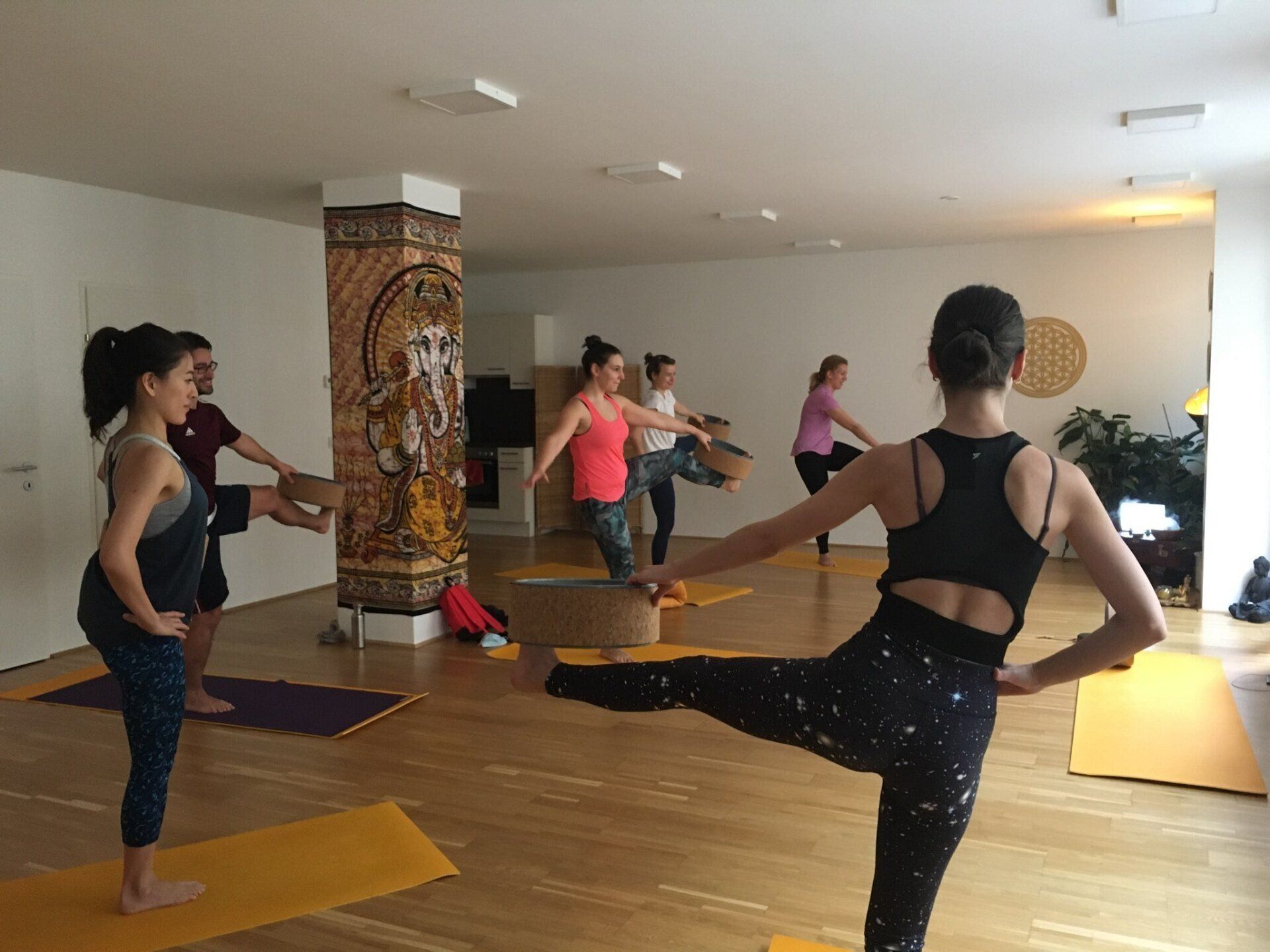uthita hasta padangusthasana with yoga wheel yoga wheel fun pose