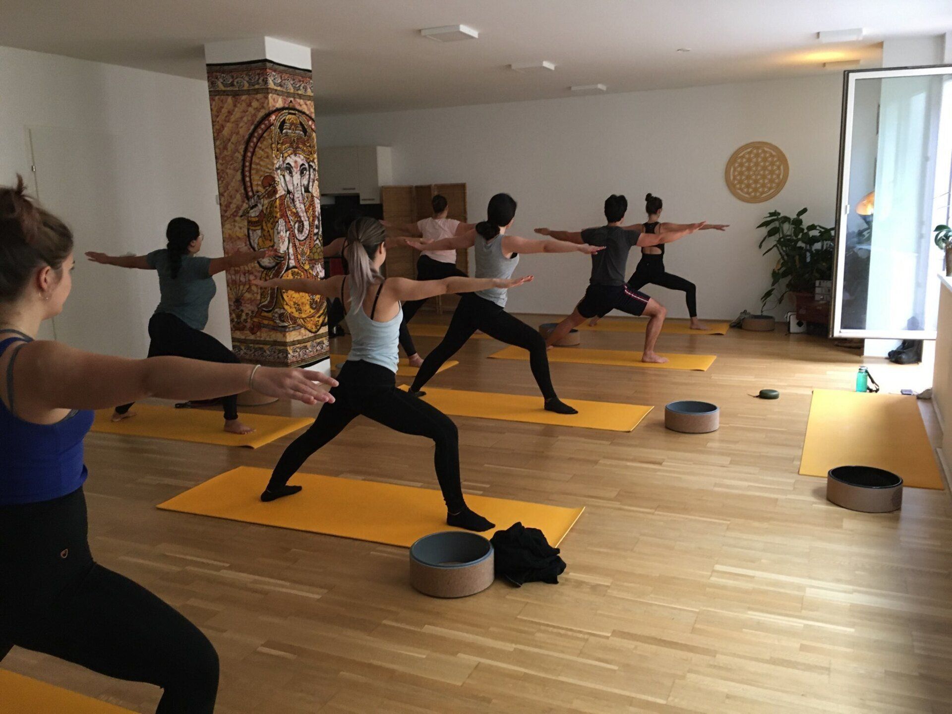 strong yoga class warrior 2 pose