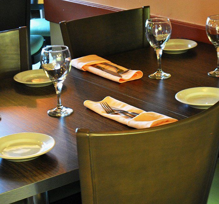 a table with plates and wine glasses on it