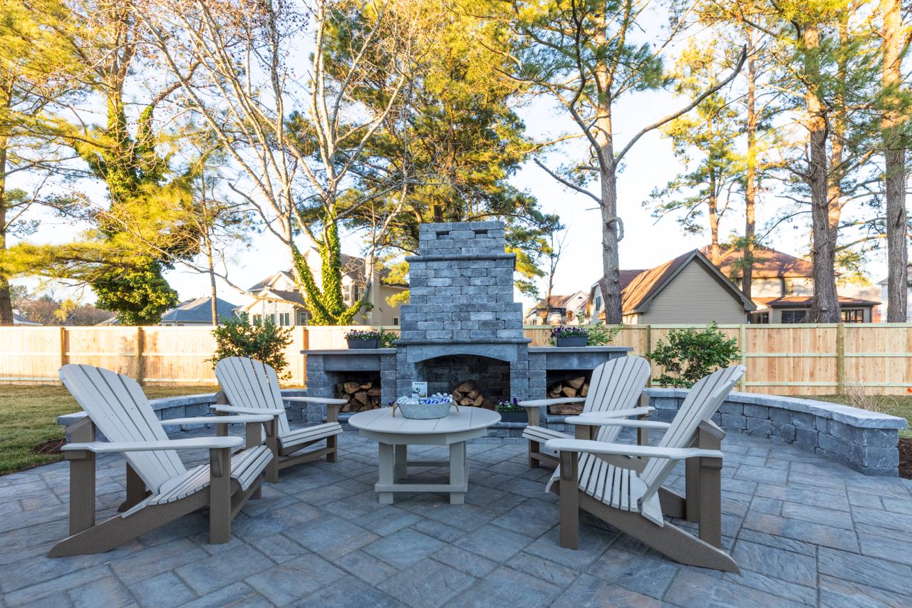 Elegant home exterior with stone fire pit  | Exterior Gallery | Stephen Alexander Homes | Chesapeake, VA