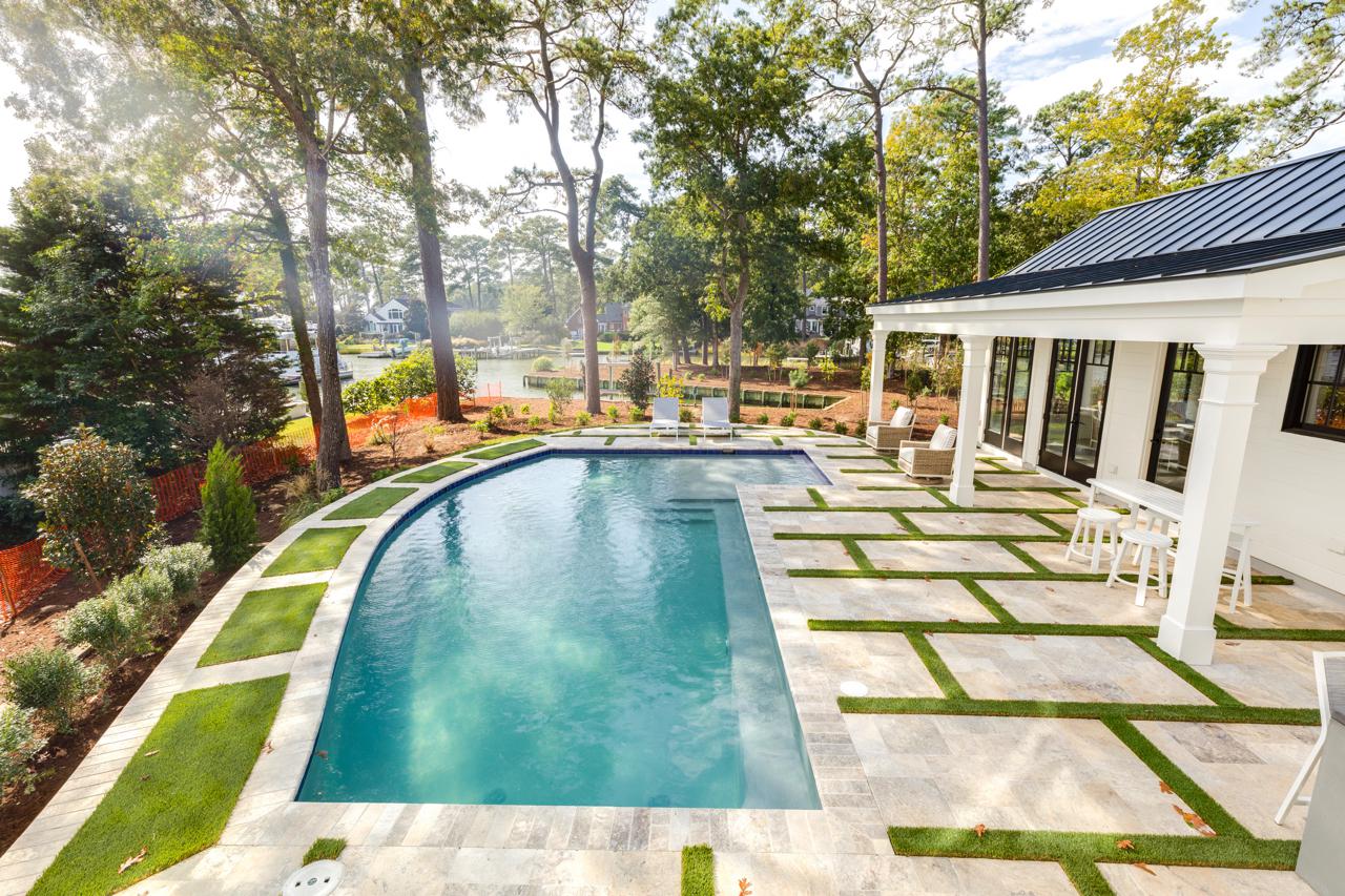 Elegant home rear exterior with view of pool | Exterior Gallery | Stephen Alexander Homes | Chesapeake, VA